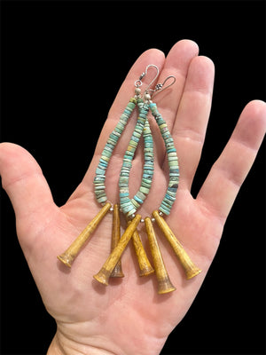 Graduated unpolished heshi-cut turquoise and vintage Naga deer antler pendants. Sterling silver detailing. Very long earrings, tribally inspired. Length 12 cm