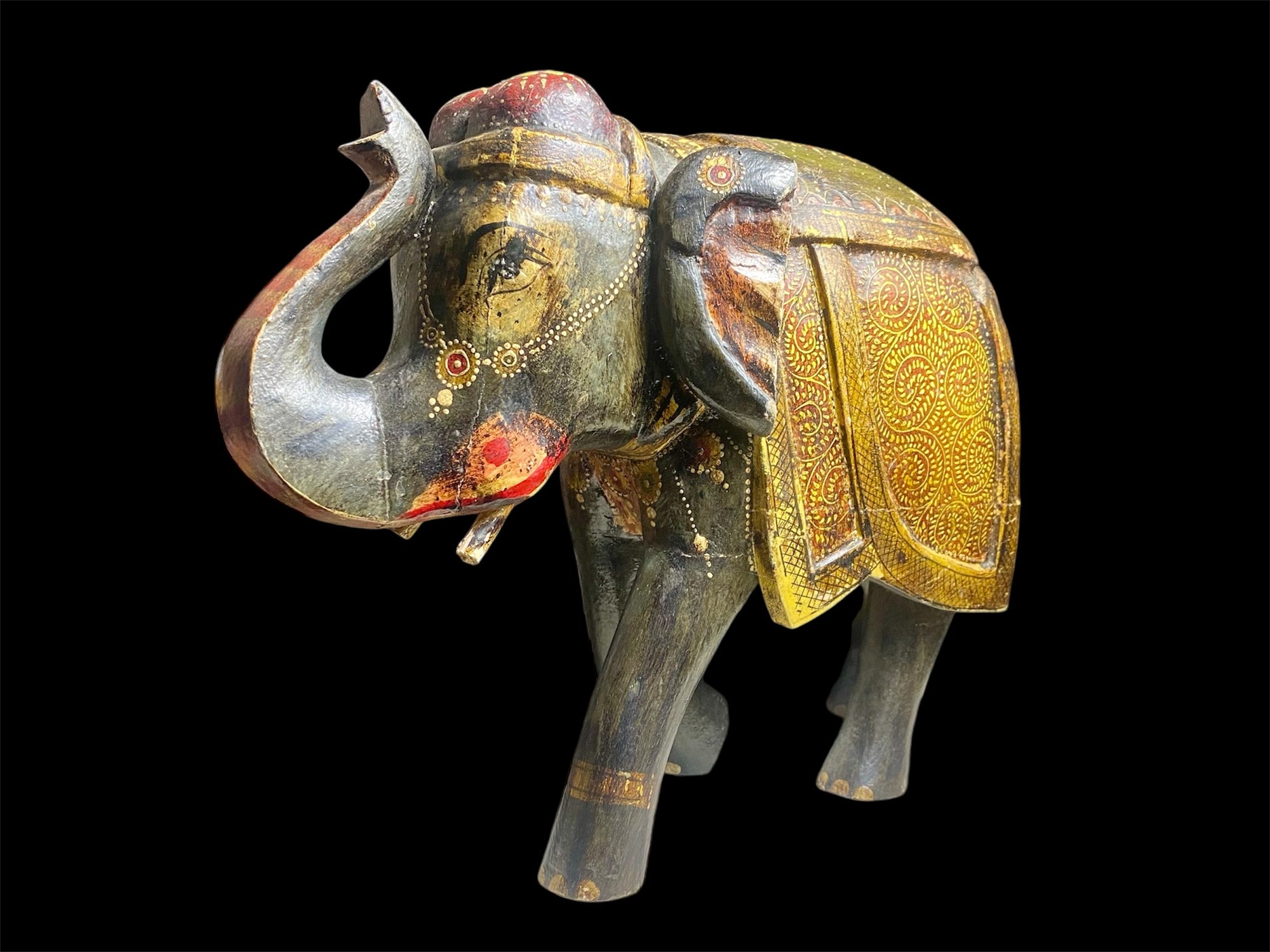 Very large vintage elephant, hand painted in rich detail, crafted in India from solid hard wood. Height 25.5, length 35 cm, depth 14 cm
