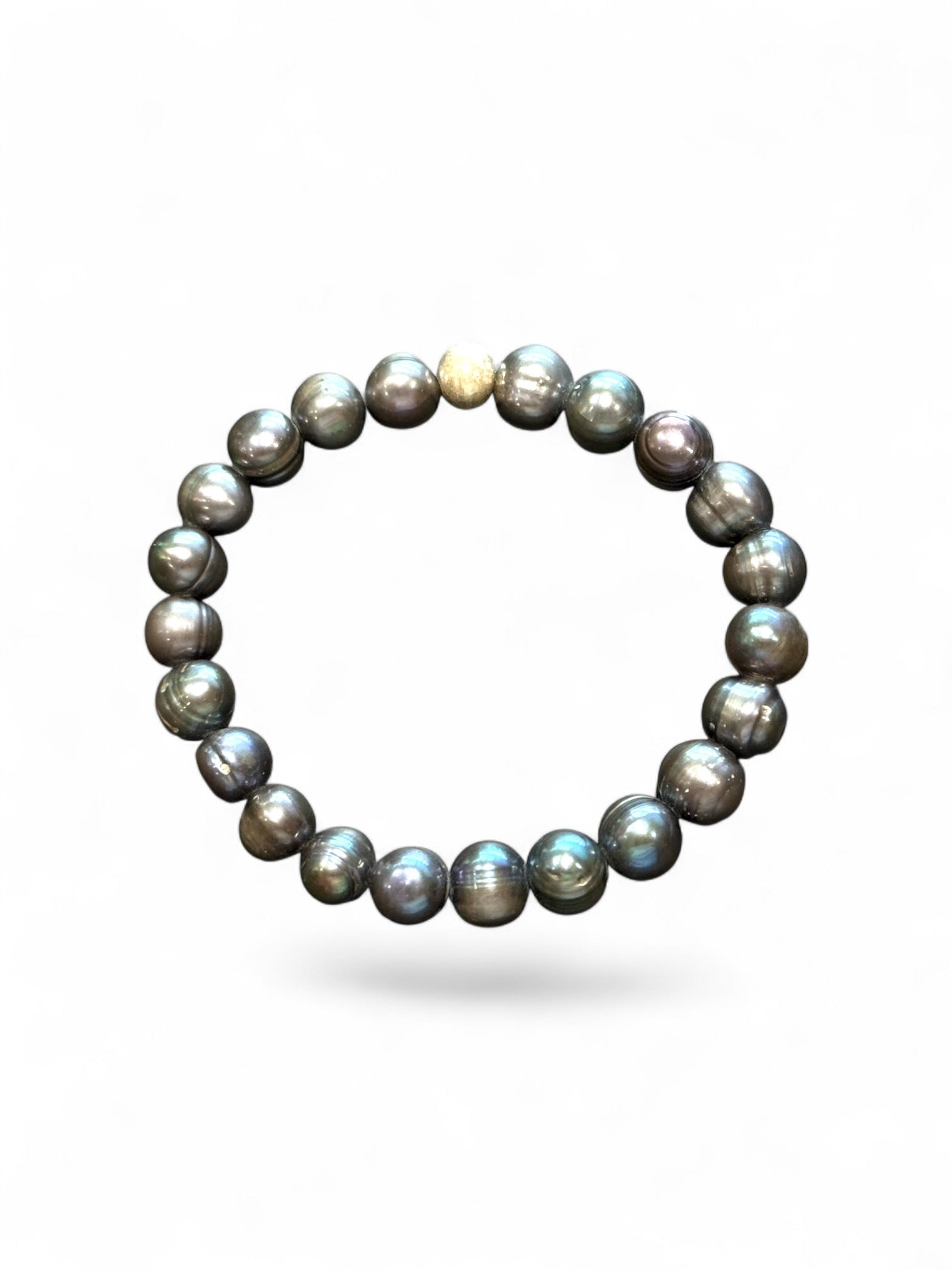 A simple and elegant bracelet of large black freshwater pearls and a single sterling silver bead. Elasticised stringing for a seamless look.