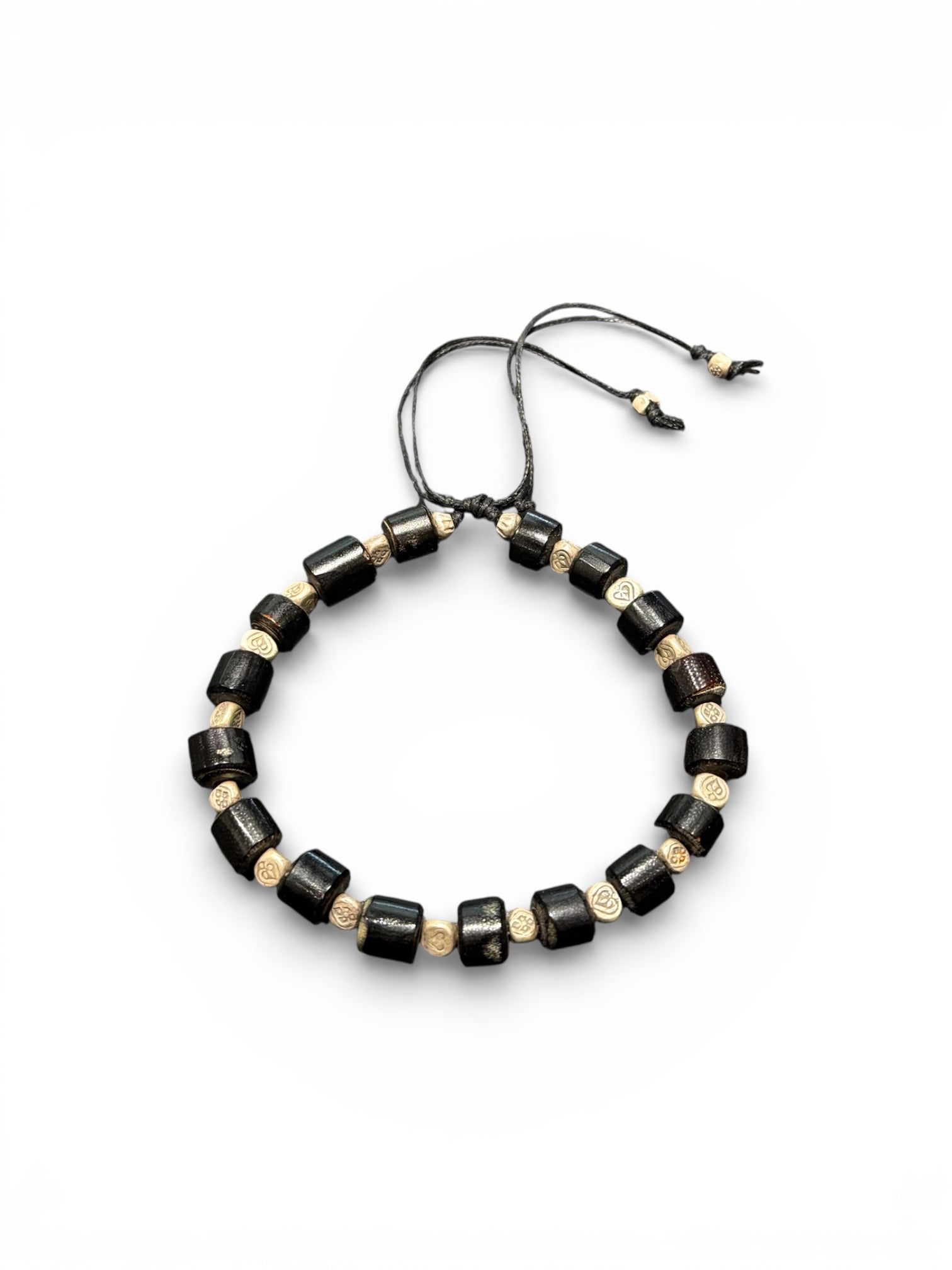 Stunning bracelet featuring antique black coral and Karen hill tribe silver. Strung on waxed cord, large & adjustable and unisex. Size 20 cm or larger