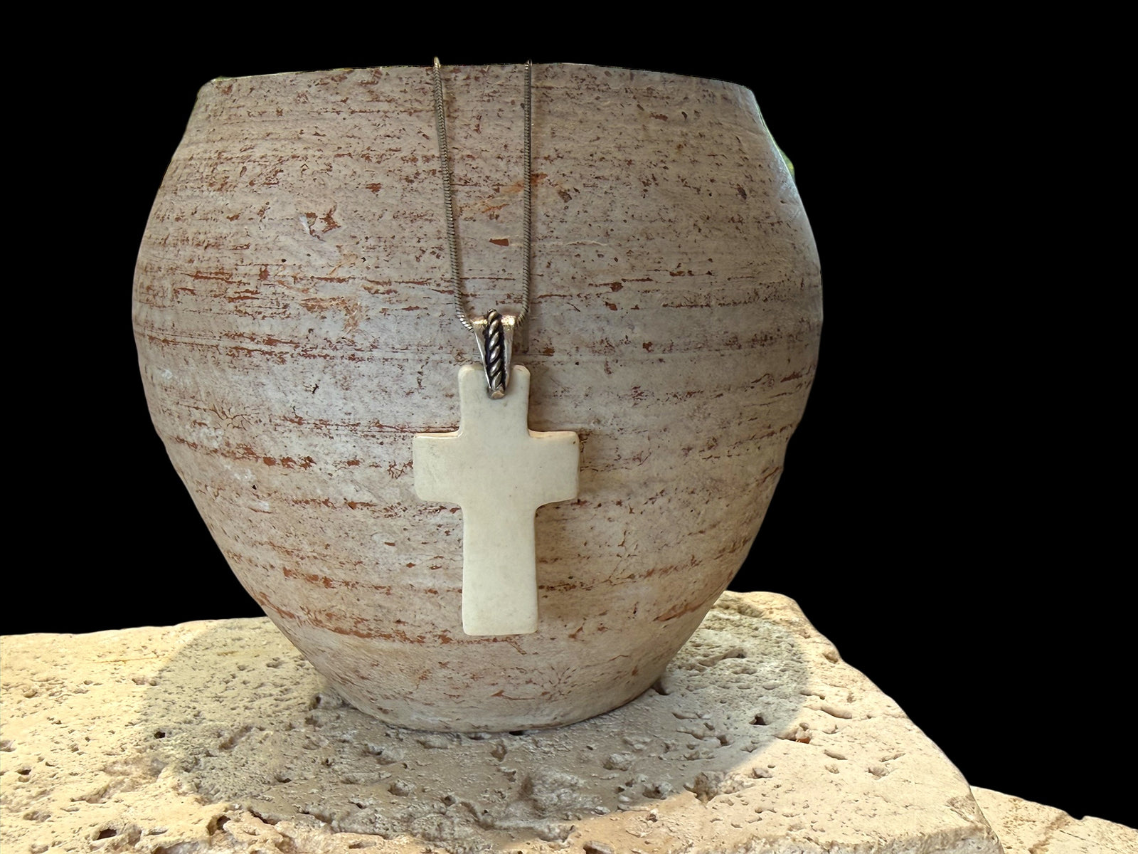 Stylish cross pendant with a southwest vibe. Carved cow bone and sterling silver. This is unisex pendant. Chain/cord not included. Length 5 cm