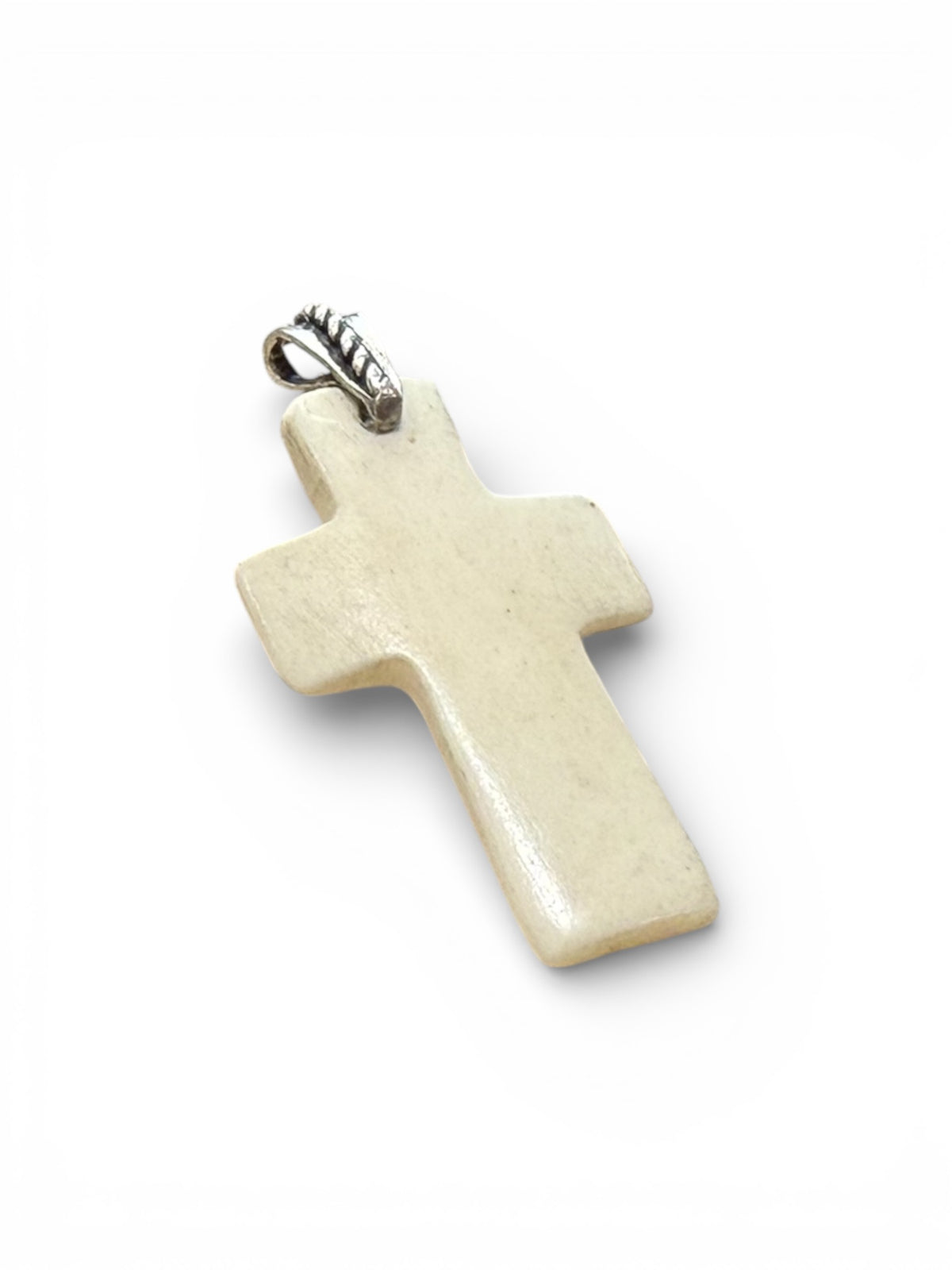 Stylish cross pendant with a southwest vibe. Carved cow bone and sterling silver. This is unisex pendant. Chain/cord not included. Length 5 cm
