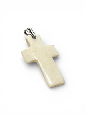 Stylish cross pendant with a southwest vibe. Carved cow bone and sterling silver. This is unisex pendant. Chain/cord not included. Length 5 cm