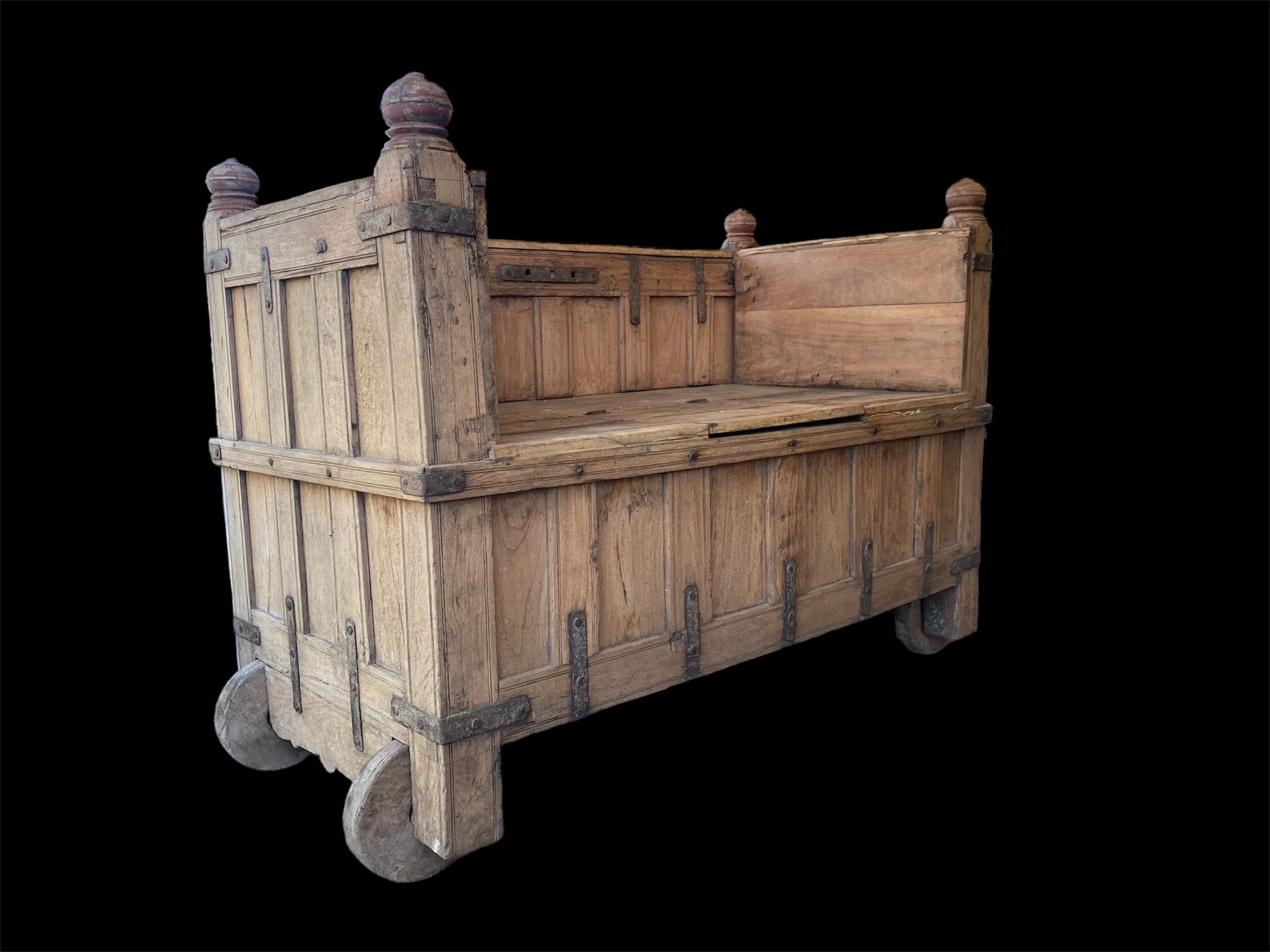 Originally a dowry chest & converted into a box seat many decades ago. Storage is available in the lower part. Four wheels and two iron rings mean that this item can be easily moved around and repositioned. Teak & rosewood, early 20th century, Southern India. Height 105 cm at highest point, length 150 cm, depth 74 cm