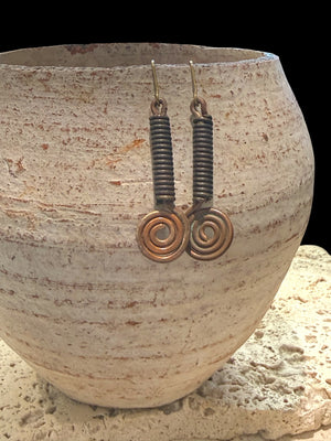 Beautifully organic earrings made from handmade bronze beads from Nagaland and copper. The hooks are made of solid brass. Length 5.5 cm