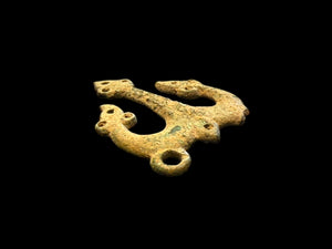 Decorative flat cast tri-lobed bronze mount, Herat region. c 10th - 13th CE. Used to decorate a leather or fabric belt or harness. Length 6.1 cm, width 5 cm.