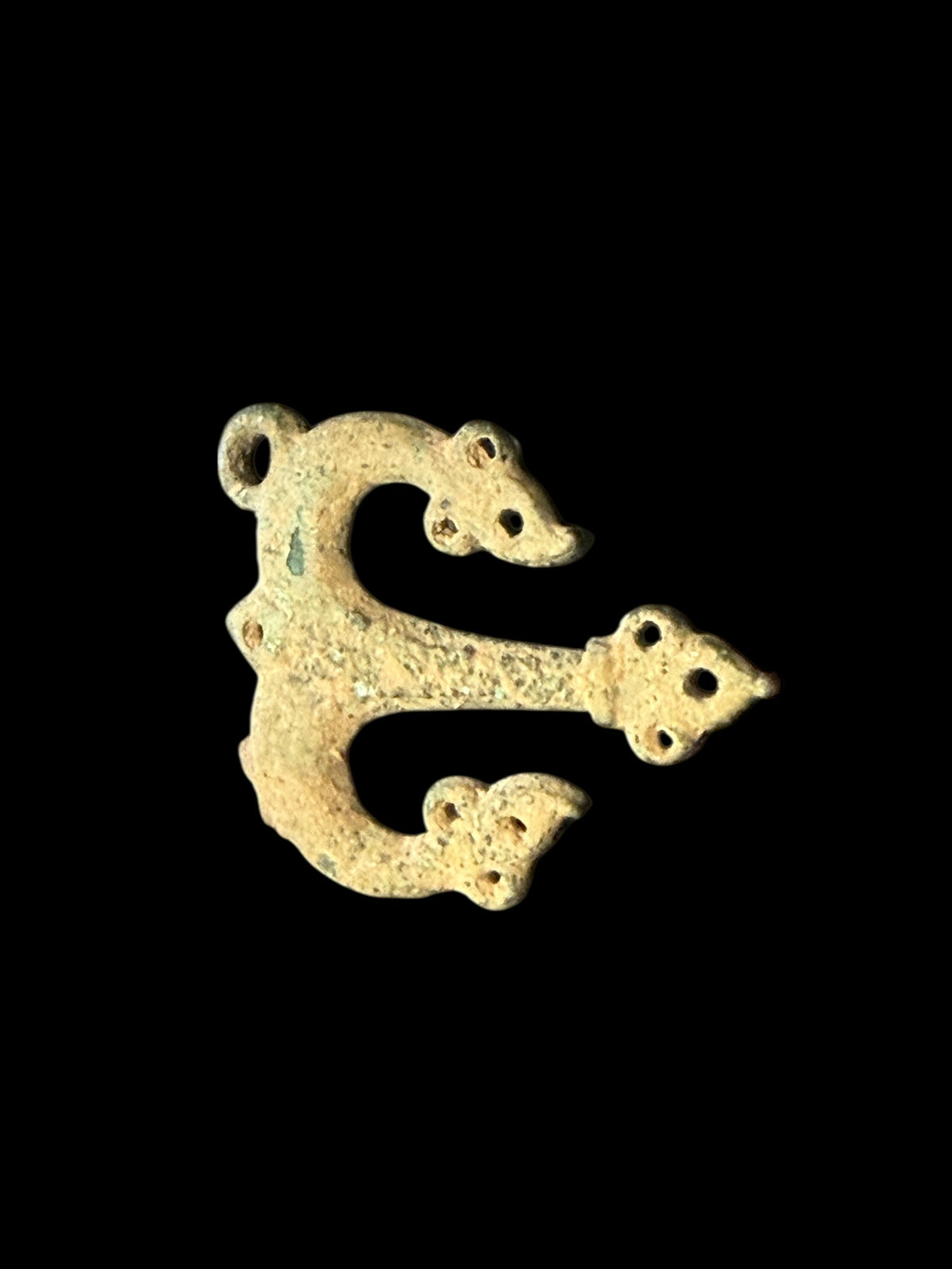 Decorative flat cast tri-lobed bronze mount, Herat region. c 10th - 13th CE. Used to decorate a leather or fabric belt or harness. Length 6.1 cm, width 5 cm.