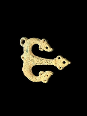 Decorative flat cast tri-lobed bronze mount, Herat region. c 10th - 13th CE. Used to decorate a leather or fabric belt or harness. Length 6.1 cm, width 5 cm.