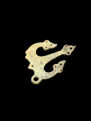 Decorative flat cast tri-lobed bronze mount, Herat region. c 10th - 13th CE. Used to decorate a leather or fabric belt or harness. Length 6.1 cm, width 5 cm.