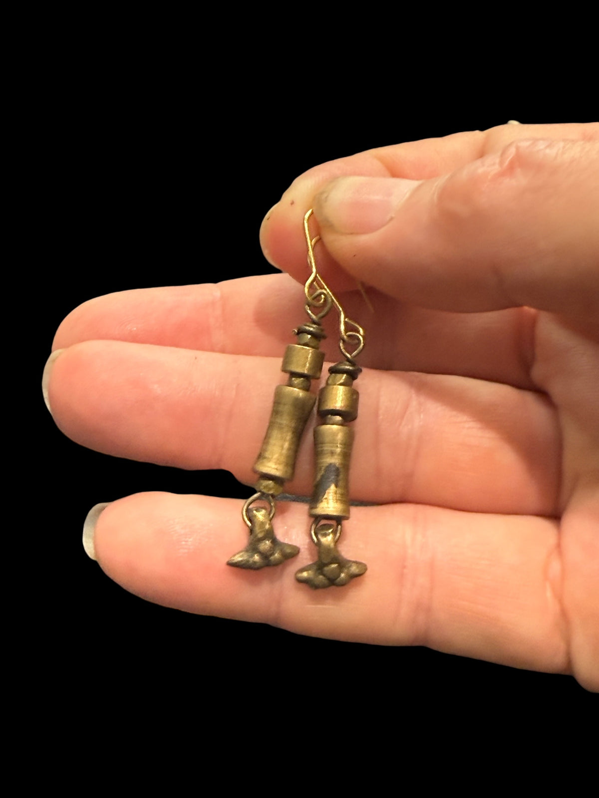 Earrings made from handmade bronze beads from Nagaland. The hooks are made of solid brass. Measurements: length including hook 5 cm