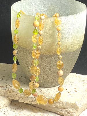 Stunning natural bead necklaces made up of graduated, etched golden citrine, peridot & jasper beads, highlighted with handmade sterling silver beads and clasp.