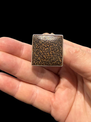 Square coconut wood and sterling silver pendant, with a solid silver back and a large and generously sized bail. This is a unisex, organic style of pendant that can be worn like a choker or on a longer chain and will look great on men or women. Measurements: 2.8 x 2.8 cm