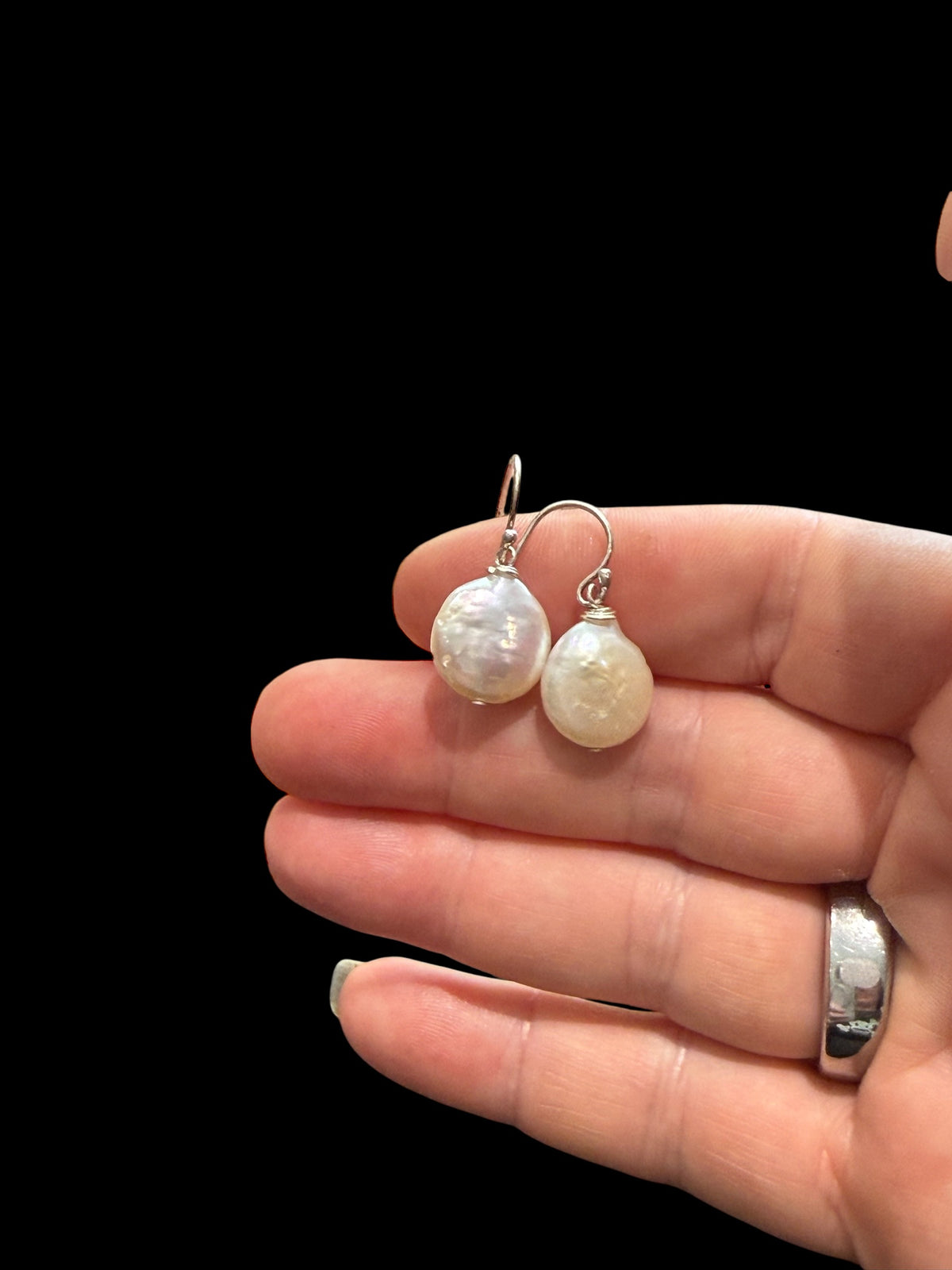 Simple cultured coin pearl earrings finished with sterling silver hooks. Pearl diameter 1.2 mm, earring length 2.8 cm