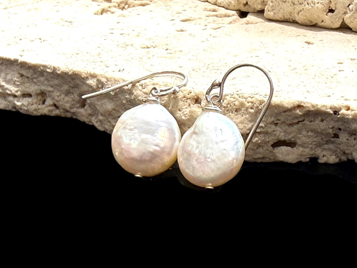 Simple cultured coin pearl earrings finished with sterling silver hooks. Pearl diameter 1.2 mm, earring length 2.8 cm