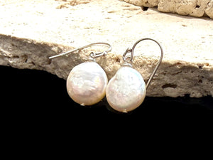 Simple cultured coin pearl earrings finished with sterling silver hooks. Pearl diameter 1.2 mm, earring length 2.8 cm