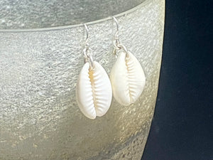 Simple cowrie shell earrings finished with sterling silver mounts and hooks. Measurements: length including hook 3.5 cm