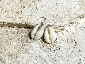 Simple cowrie shell earrings finished with sterling silver mounts and hooks. Measurements: length including hook 3.5 cm