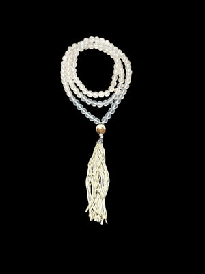 Mala prayer bead necklace of 108 beads. Crystal beads are highlighted with a carved lotus root and sterling silver tassel. 80 cm length, pendant 13 cm.