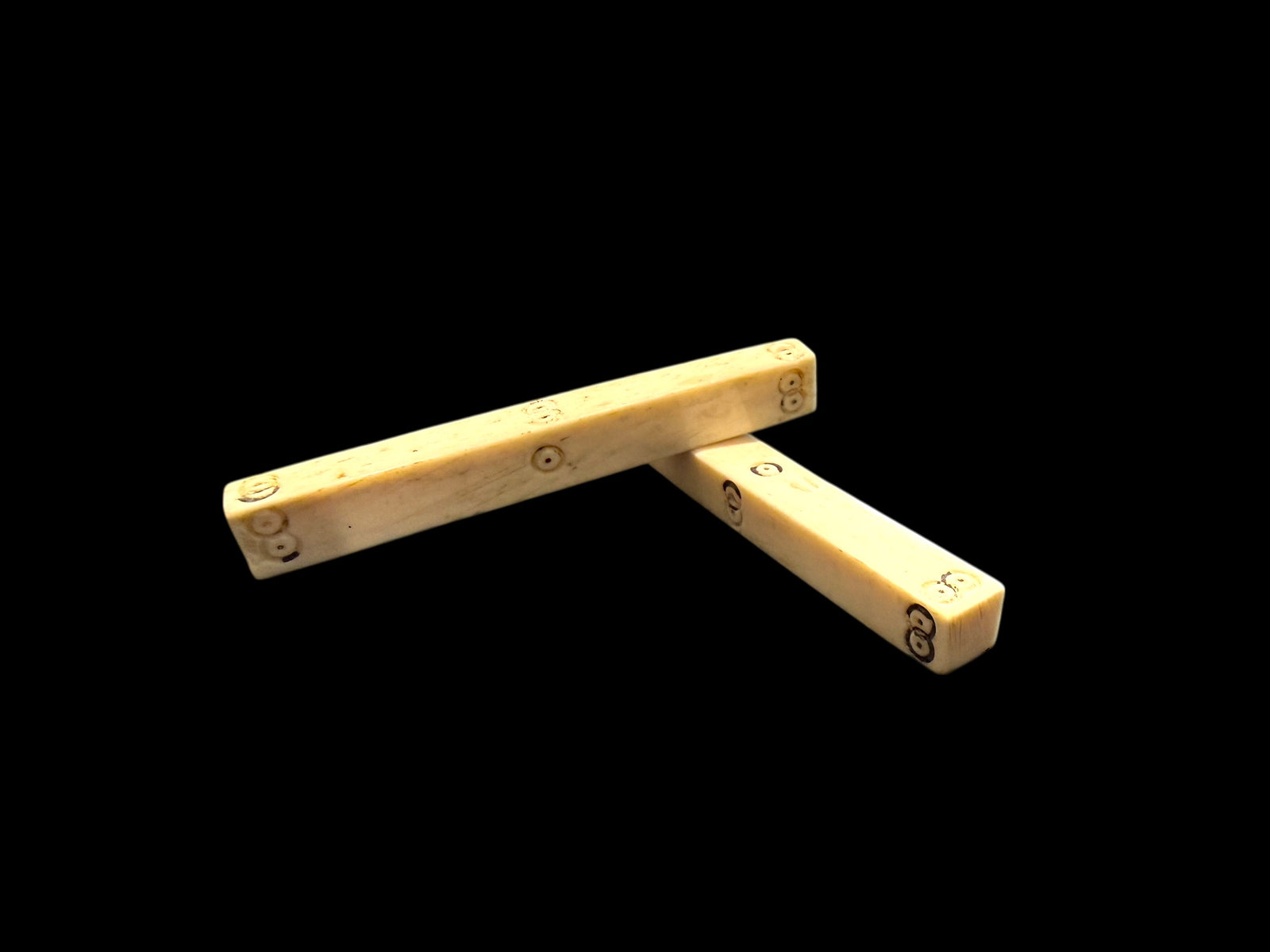 Pair of vintage stick Mah Jong dice, hand carved from deer antler. Northern Vietnam. Measurements: length approximately 7 cm, 6 mm x 8 mm