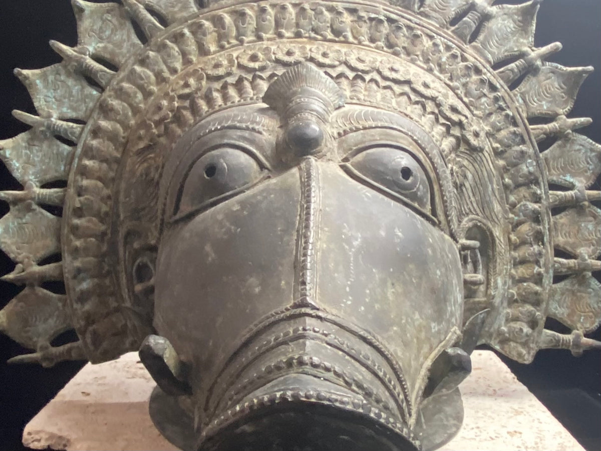 Ceremonial dancer's headpiece worn as a mask in the form of Vishnu's incarnation as Varaha. For ritual use in annual Dharmanema dance festivals. Early 20th century. Bronze lost wax casting. From Kerala, southern India. Measurements: Width 51 cm, height 43 cm, depth 32 cm.