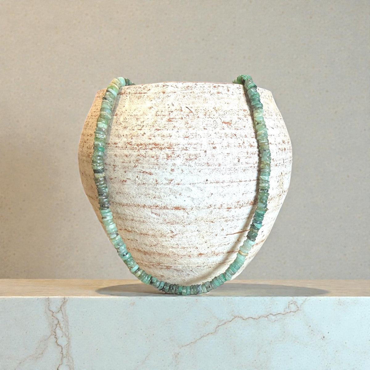 Heshi cut natural emerald necklace features sterling silver findings and a hook clasp. Length 43.5 cm.