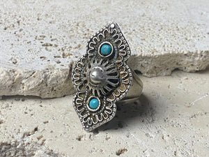 beautiful statement ring made by a Rajasthani village silversmith just outside of Jaipur. Sterling silver and blue ceramic beads with hand wired (not cast) filigree face decoration. Rajasthan, India. Looks great on a man's hand or woman's hand.   Measurements:  Face 4 cm x 2.5 cm Size 9.25 | 19.25 mm