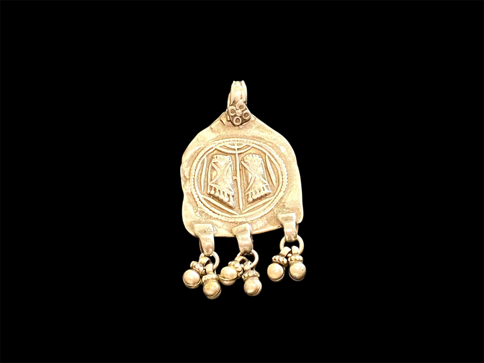 Antique silver amulet depicting the feet of the goddess Lakshmi. High grade silver, mid to late 19th century. India. Worn to attract wealth and good fortune. Height 5.5 cm