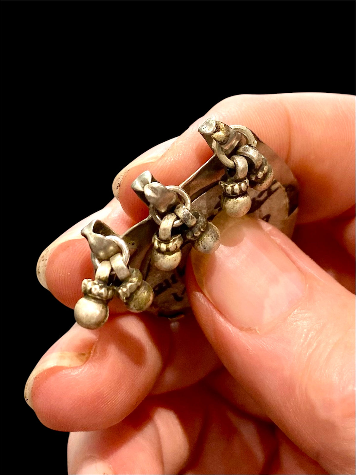 Antique silver amulet depicting the feet of the goddess Lakshmi. High grade silver, mid to late 19th century. India. Worn to attract wealth and good fortune. Height 5.5 cm