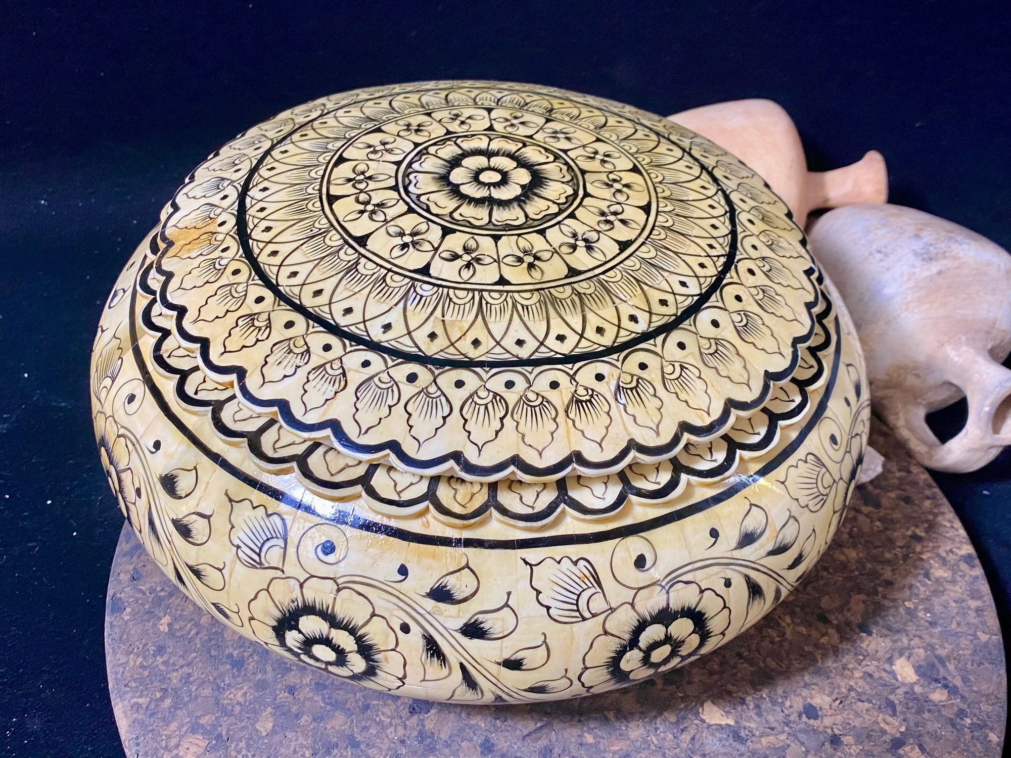 A beautiful low oval lidded bowl or box, traditionally called an opium pot because of its shape. Crafted from hand shaped panels of camel bone over wood, then hand painted. Hand made in Rajasthan, India. Measurements: diameter 24.5 cm, height 10 cm.