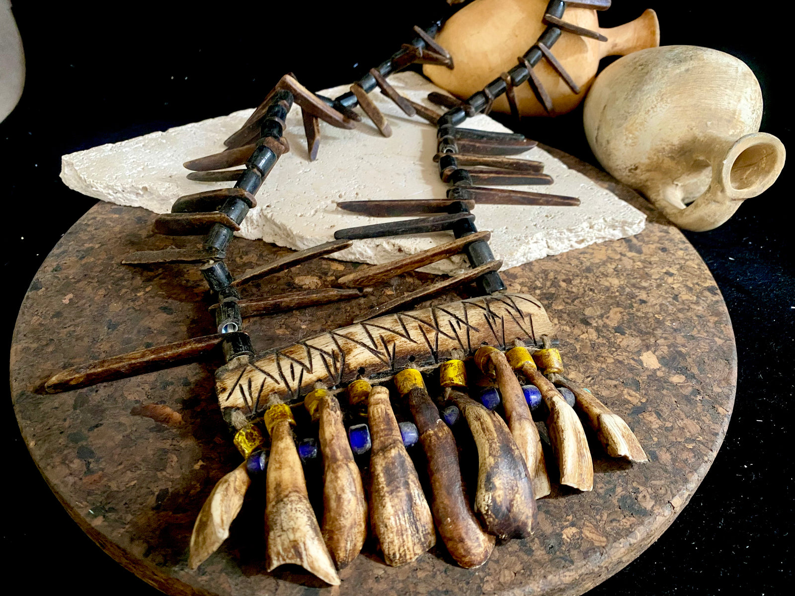 long buffalo tooth and bone necklace. It's made with a combination of buffalo bone, buffalo tooth and ceramic beads. This is a new necklace made in typical Naga tribal style. Length 45 cm