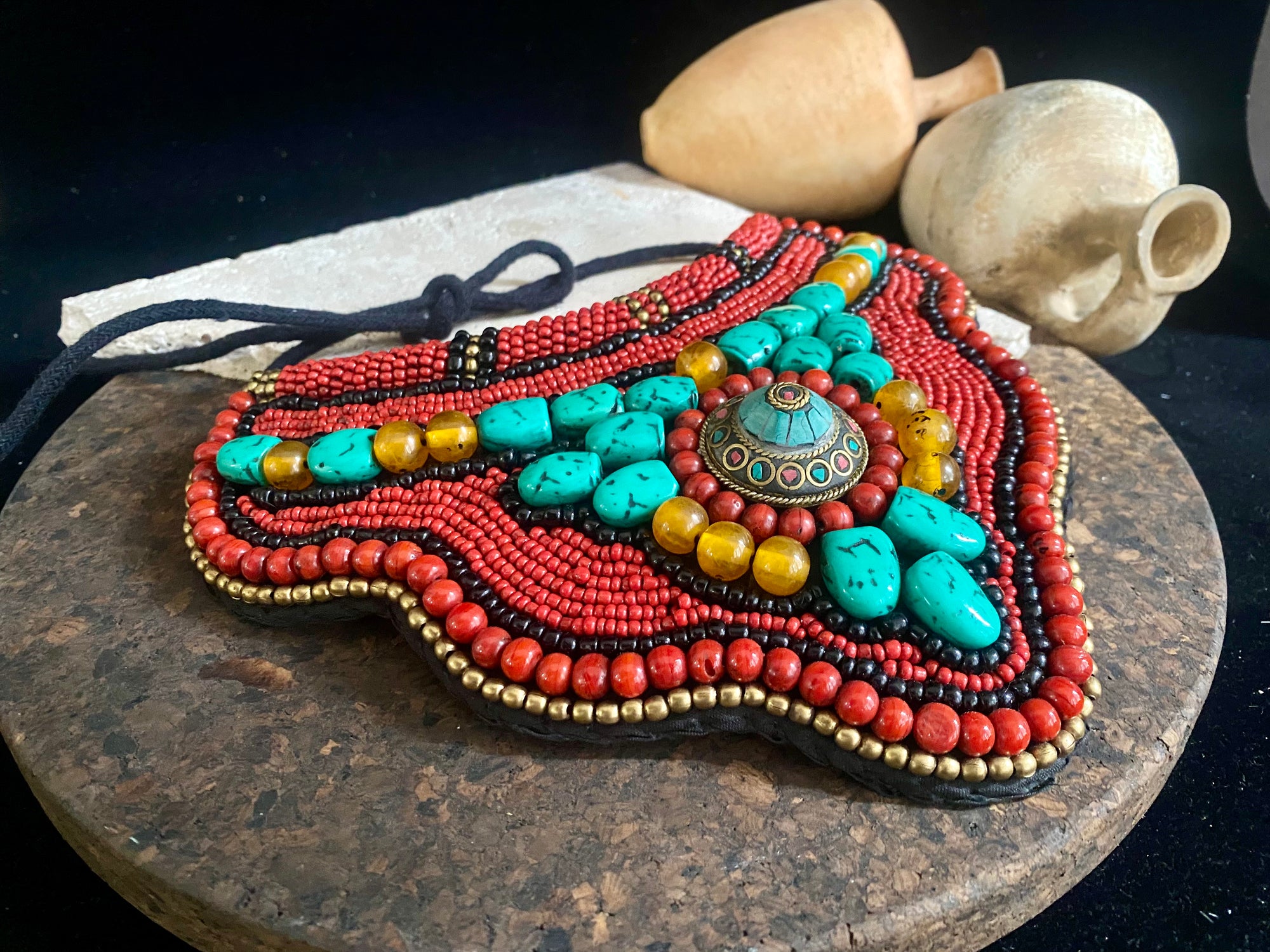 Traditional bib or pectoral beaded necklace, with a multitude of colourful ceramic and resin stones sewn onto a stiff fabric background and tied around the neck with a cord. Sikkim jewellery, India