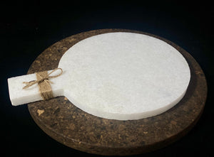 Our simple marble plate is designed for serving nibbles or for use as a cheeseboard. However, its simplicity means that it would also make a very nice plant or object stand. Hand carved in Rajasthan from white marble. A simple handle with hole for hanging completes the look. Measurements: length 29 cm, 21.5 cm disk diameter
