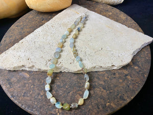 Striking boulder stone translucent blue opal necklace with sterling silver bead detailing, finished with a sterling silver hook clasp. Length 45.5 cm