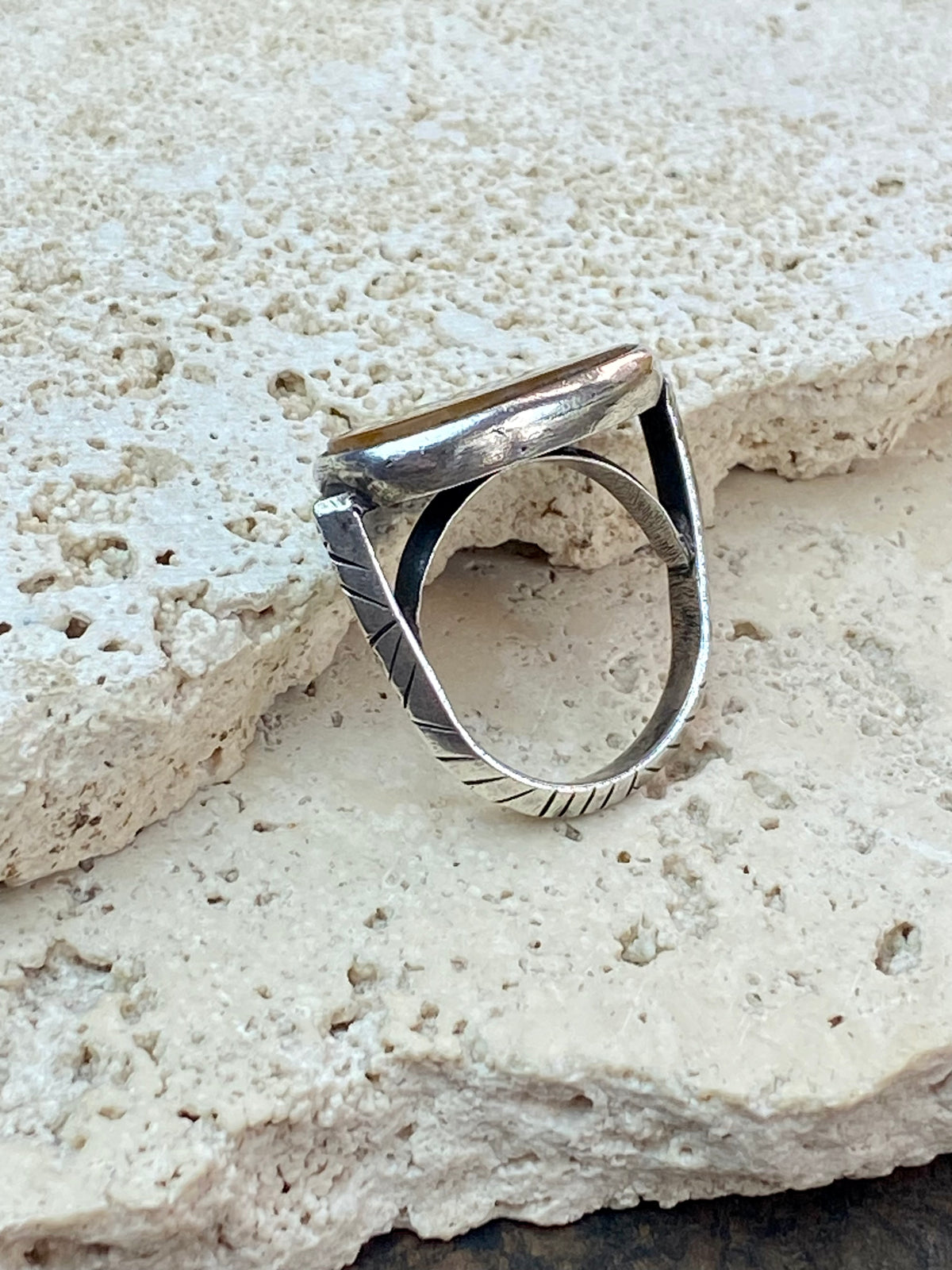 Afghani ring features an antique honey-coloured engraved carnelian prayer plaque set into a new silver band. Sits high on the finger and is a statement piece. High grade or sterling silver has been used to make the ring band. Men or women's ring. Measurements: Carnelian 2.4 x 1.4 cm, inner diameter 19.75 mm | Size 10