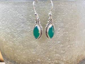Simply elegant leaf shaped earrings with a beautifully detailed bezel to show off the natural beauty of the cabochon stones. Sterling silver hooks complete the look. Our earrings are open-backed to allow natural light to show through. Length including hook 2.7 cm