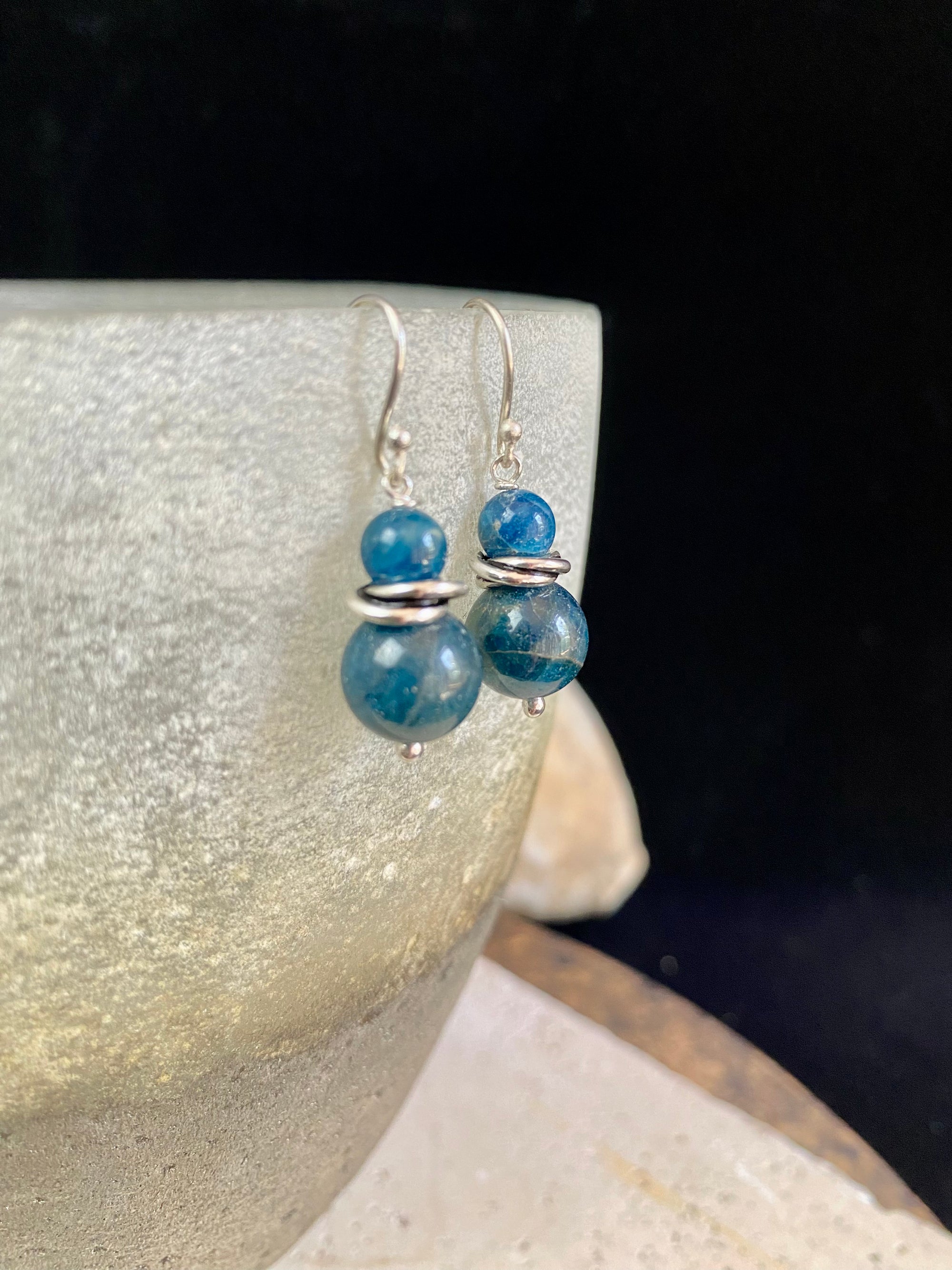 Simple, elegant apatite earrings featuring natural blue, graduated beads, finished with sterling silver detailing and hooks.   Apatite earring featuring sterling silver decoration 925 sterling silver shepherd hooks high quality natural stones light and easy to wear  Measurements: 3.3 cm  height including hook 