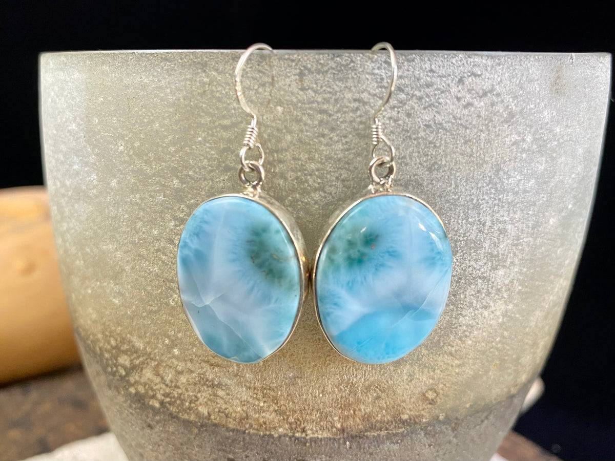 Larimar stone earrings set in sterling silver. Each pair of earrings is unique, cut and mounted to showcase the beauty of the individual stones.