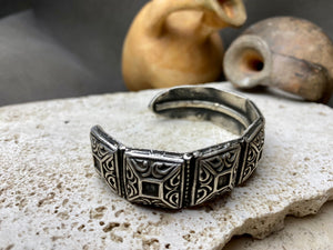 A modern interpretation of an antique style of bracelet, this fine cuff is hand crafted from sterling silver by Rajasthani silversmiths. Exquisitely detailed, the oxidised finish shows off the workmanship beautifully. There is some small room for movement in this cuff, and it is designed to fit an average sized wrist.  Measurements: Inside opening is 6.5 cm, with room for expansion or contraction