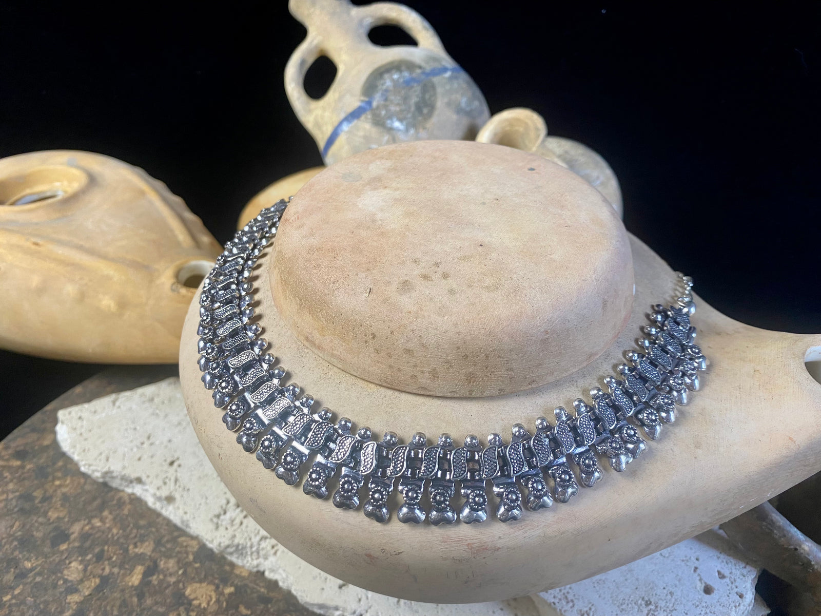 A classic Rajasthani style Indian necklace in white metal (non silver). Flattering to any neckline, it can be worn as a choker or a longer necklace by fastening the chain length to suit. It also be worn as an anklet by removing the chain altogether.  Beautiful without the sterling silver price tag. Measurements: 47.2 cm length with chain. Without chain 25.5 cm.