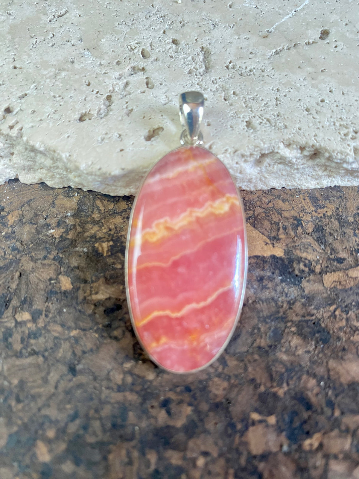The most beautiful rhodochrosite we've ever seen. Every piece tells a story, all set in sterling silver bezels with generous bails to take the largest of chains or cords. These are beautiful statement pieces of jewellery.