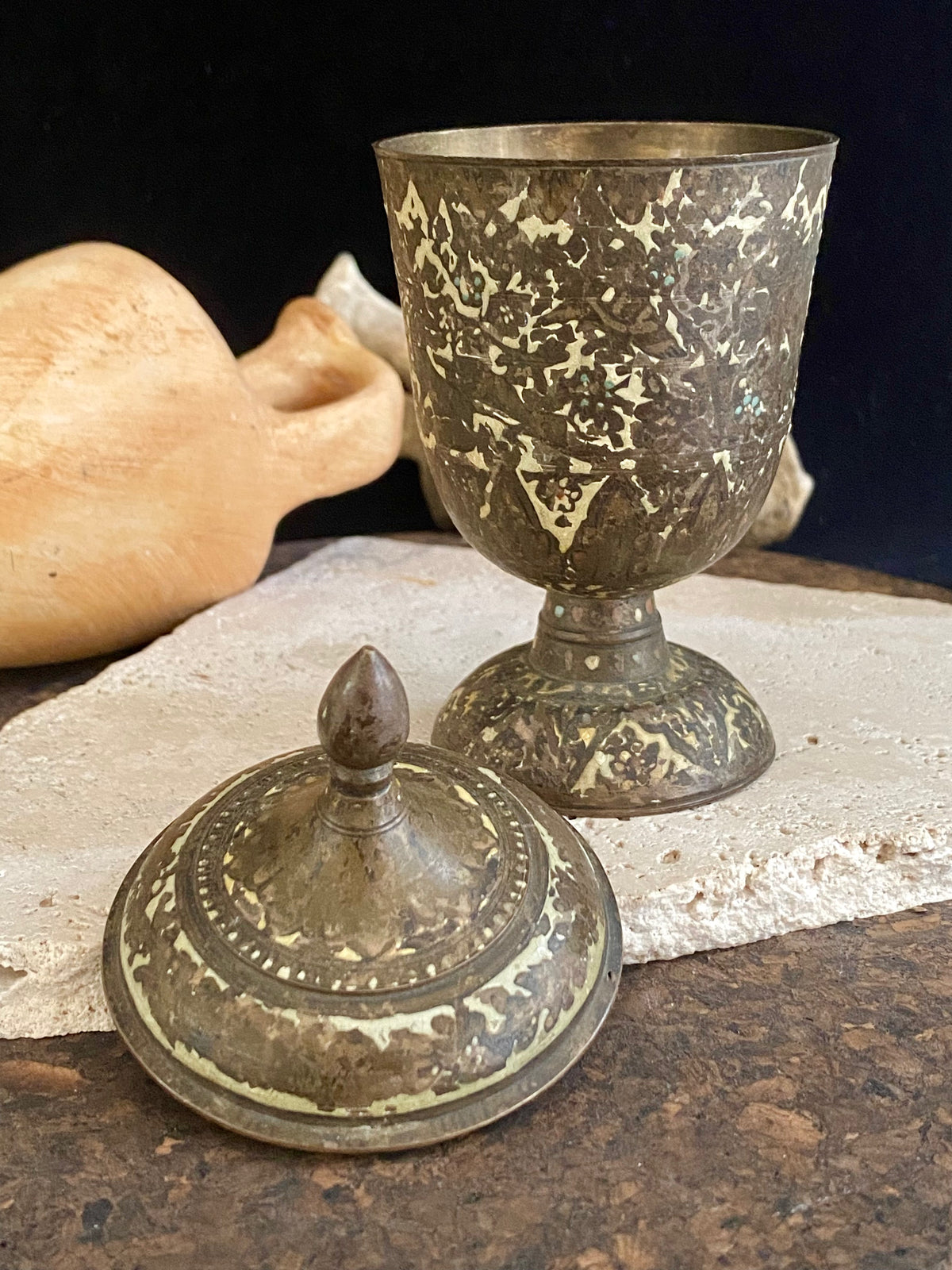 Russian Orthodox church communion chalice. Early 20th century. Engine turned brass with elaborate inlay enamel decoration in white with blue and red highlights. The enamel work is very worn and rubbed in places. Height 15 cm, width 6.5 cm.