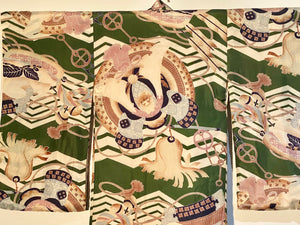 Small, hand sewn child's kimono suitable for either sex. A tasteful design features greens, tans, navy, lilac and pale blue colours in an abstracted design reminiscent of its era. Padded and lined. Hand stitched silk ties with fine thread tassel detailing. No damage, excellent condition. Circa 1950's.