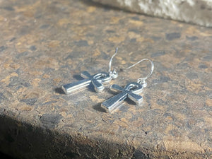 Stylish ankh earrings. The body of the earring is made from a non-tarnishing white metal indistinguishable from silver, while the hooks are sterling silver. Lightweight and easy to wear. Measurements: drop including hook 3 cm