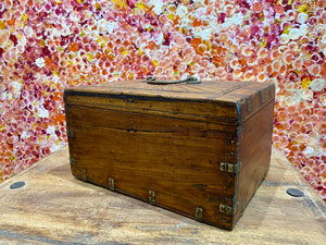 A lovely old southern Indian cash box with carved top and original brass trim, handle and hinges. Fitted with two small shelves inside. Made from teak, this would make a lovely trinket box, key box, jewellery, watch or cufflink box Circa 1880 - 1920. Measurements: length 27.5 cm  x depth 19 cm, height 15 cm.