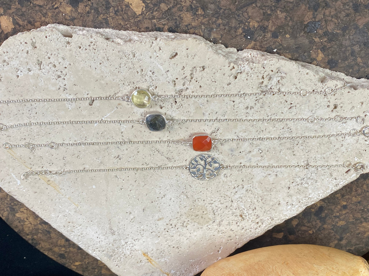 Elegant bracelets set with single stones in a sterling silver chain and clasp. Note that these bracelets are adjustable in length to suit your wrist size  Measurements: 17.2 - 19.8 cm length