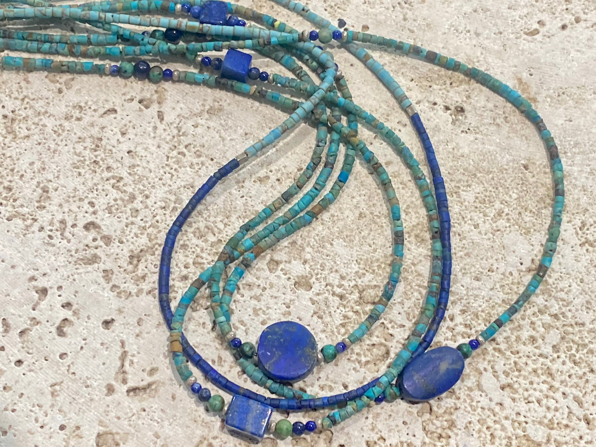 Fine beaded lapis and turquoise necklaces made from tiny tubes of turquoise, highlighted with lapis, African jasper and sterling silver. Our unisex necklaces are perfect for either men or women.