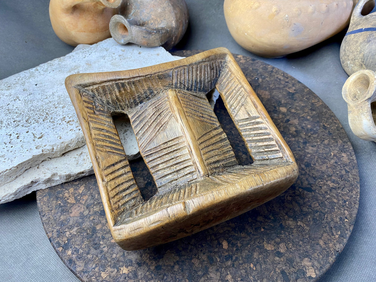 Old Oromo tribe wooden headrest from Ethiopia. Carved from a single piece of wood. Pre 1950. The patina and wear on this piece are appropriate to its age. In particular, note that the upper surface is darkened from use and the leading front edge is both lower than the rear edge and is also smooth from use.
