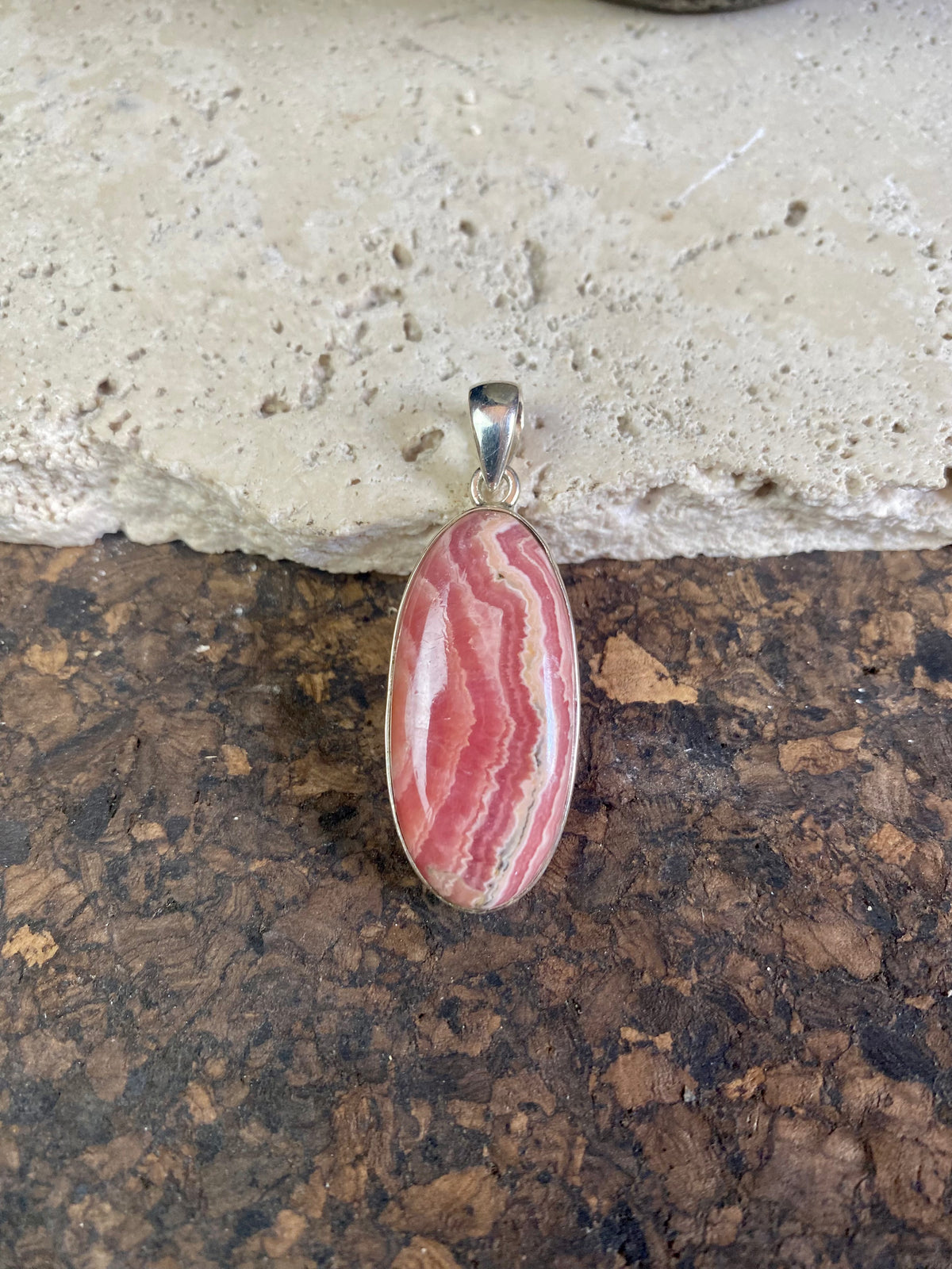 The most beautiful rhodochrosite we've ever seen. Every piece tells a story, all set in sterling silver bezels with generous bails to take the largest of chains or cords. These are beautiful statement pieces of jewellery.