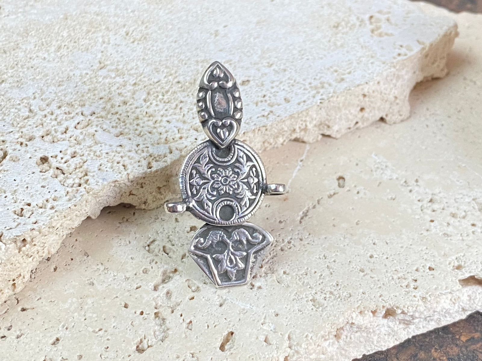 Stunning tribal ring from regional Rajasthan, India. High grade or sterling silver. Adjustable back so it will fit a number of different finger sizes.  Measurements:  Ring face: 4.5 x 2.6 cm Size: Anywhere from size 6 to size 8, this ring is adjustable