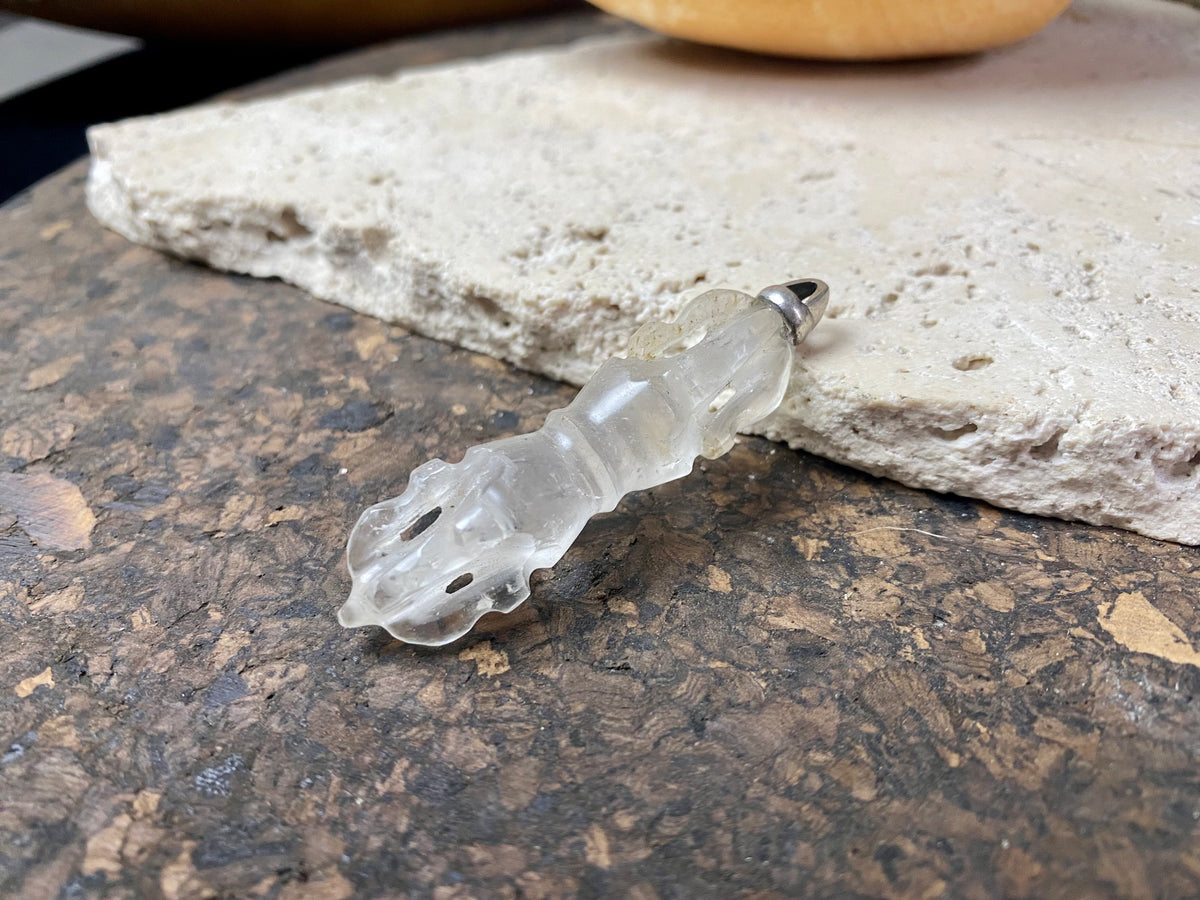 Hand carved rock crystal dorje or vajra pendants. Top mounted sterling silver bail. Approximately 6 cm in length and carved from Himalayan quartz.  
